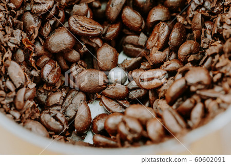Close up coffee bean on coffee grinder 60602091