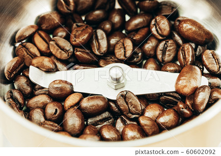 Close up coffee bean on coffee grinder 60602092
