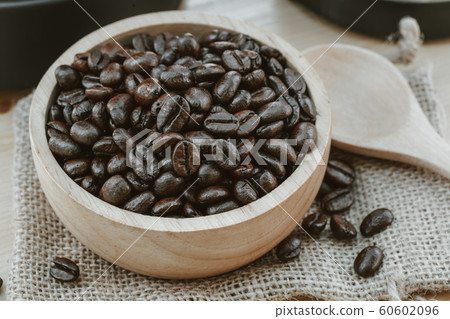 Coffee bean on wooden bowl with home made coffee 60602096