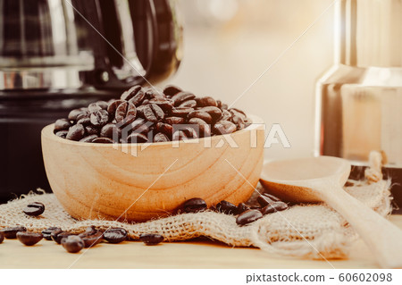 Coffee bean on wooden bowl with home made coffee 60602098