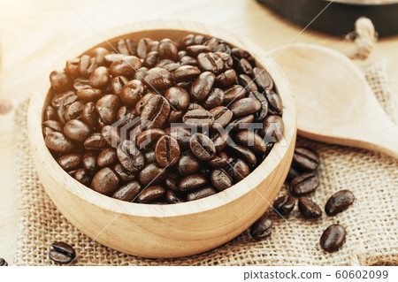 Coffee bean on wooden bowl with home made coffee 60602099
