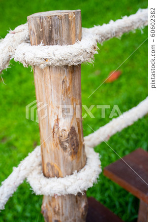 railing made from rope and timber 60602382