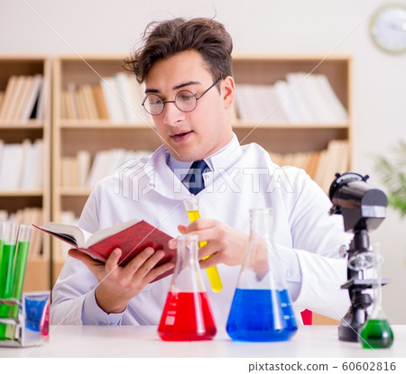 Mad crazy scientist doctor doing experiments in a laboratory 60602816
