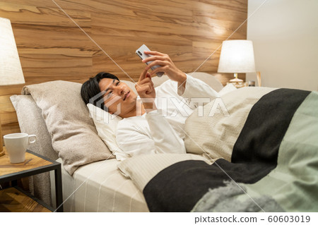 Young man sleeping bedroom lifestyle image 60603019