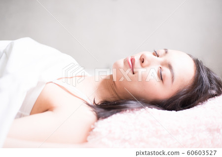 woman sleeping in bed woman sleeping in bed 60603527