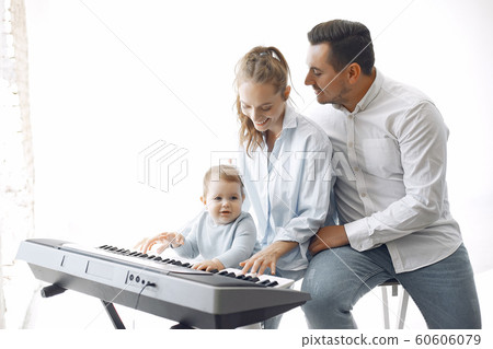 Beautiful family spend time in a music studio 60606079