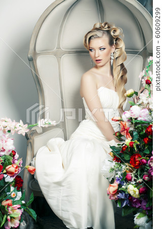 beauty young bride alone in luxury vintage interior with a lot of flowers, makeup and creative hairstyle beauty young bride alone in luxury vintage interior with a lot of flowers, makeup and creative hairstyle 60609299