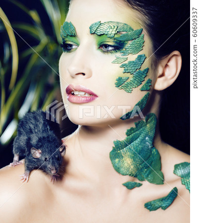 woman with creative make up like snake and rat in her hands, halloween horror closeup joke scary woman with creative make up like snake and rat in her hands, halloween horror closeup joke scary 60609337