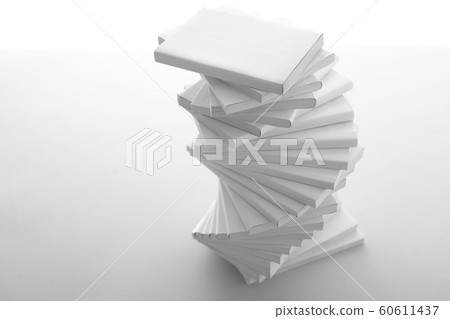 Stacked white books and laptop Stacked white books and laptop 60611437