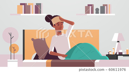 sick woman with wet towel on forehead unhealthy african american girl reducing high fever suffering from cold flu virus illness concept modern living room interior portrait horizontal sick woman with wet towel on forehead unhealthy african american girl reducing high fever suffering from cold flu virus illness concept modern living room interior portrait horizontal 60611976