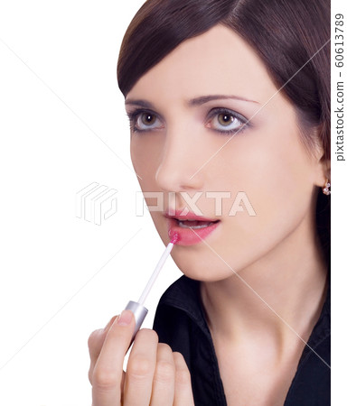 picture of beautiful woman applying lipstick using 60613789