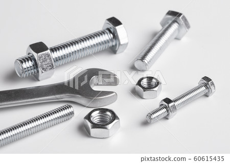 Bolts and nuts on a white background. Bolts and nuts on a white background. 60615435