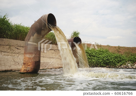 Wastewater from two large rusty pipes merge into Wastewater from two large rusty pipes merge into 60616766