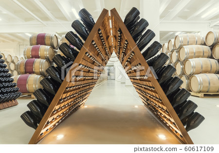 stacked of old wine bottles in the cellar 60617109