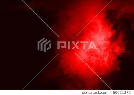 abstract red powder explosion on black background.abstract red powder splatted on black background. Freeze motion of red powder exploding. 60621273