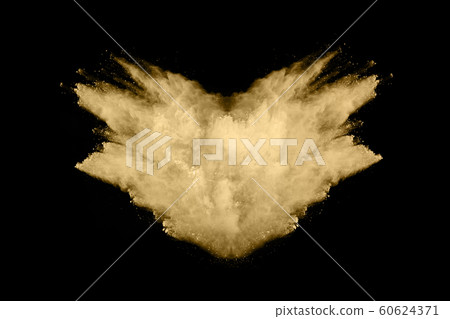 Golden powder explosion on black background. Golden powder explosion on black background. 60624371