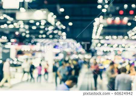 Blur event hall in large exhibition center with people walking Blur event hall in large exhibition center with people walking 60624942