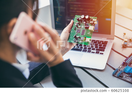 Electronic hardware engineer business person calling with chip supplier or contact for order 60625108