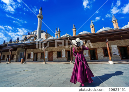 Beautiful girl walking at mosque in Konya, Turkey. Beautiful girl walking at mosque in Konya, Turkey. 60625461