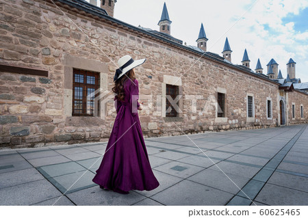 Beautiful girl walking at mosque in Konya, Turkey. 60625465