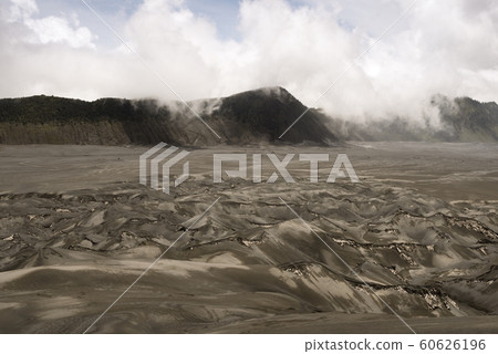 Volcanic Ash Shaping The Arid Landscape Around The Bromo Volcano In Java, Indonesia Volcanic Ash Shaping The Arid Landscape Around The Bromo Volcano In Java, Indonesia 60626196