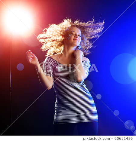 young woman dancing young woman dancing 60631436