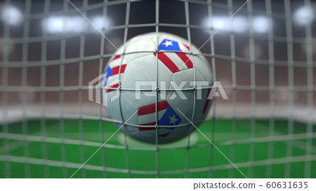 Football with flags of Puerto Rico in net against blurred stadium. 3D rendering 60631635