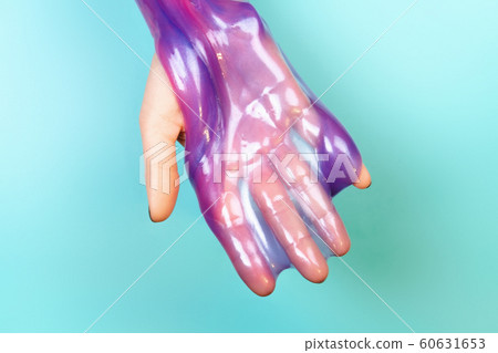 hands with holding slime in purple color hands with holding slime in purple color 60631653