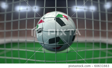 Football with flags of Sudan in net against blurred stadium. 3D rendering Football with flags of Sudan in net against blurred stadium. 3D rendering 60631663