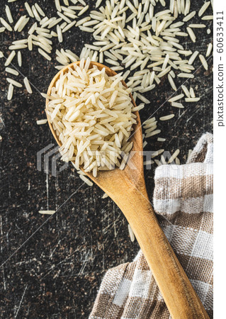 Uncooked indian long rice. Uncooked indian long rice. 60633411