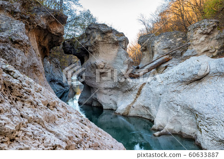 Fall landscape with quick narrow mountain river with clean water Fall landscape with quick narrow mountain river with clean water 60633887