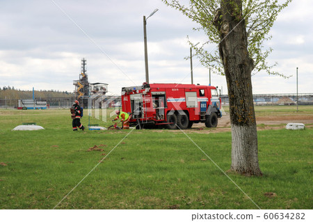 A large red fire rescue vehicle, a truck to  60634282