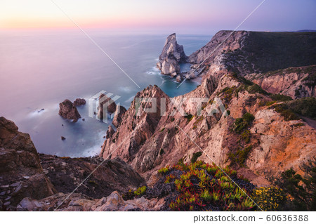 Beautiful Praia da Ursa Beach in sunset light. Surreal scenery of Sintra, Portugal. Atlantic Ocean coastline landscape 60636388
