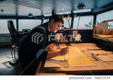 Marine navigational officer during navigational watch on Bridge 60637634