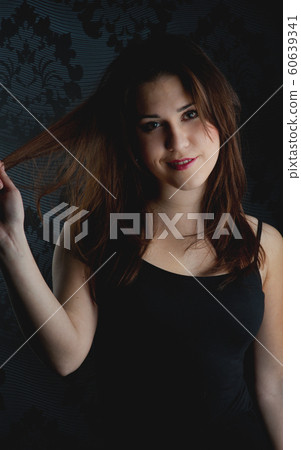 fashion model on a dark background fashion model on a dark background 60639341