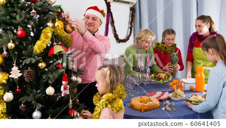 Happy family is preparing for celebration New Year together Happy family is preparing for celebration New Year together 60641405