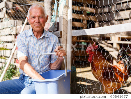 Older man near henhouse Older man near henhouse 60641677