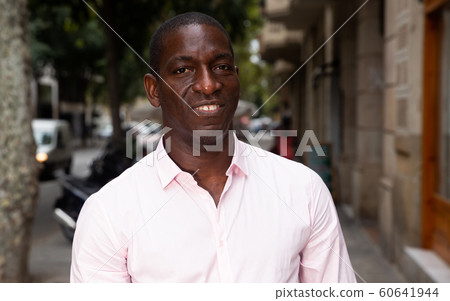 Cheerful man enjoying walk 60641944