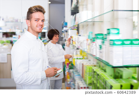 Portrait of two friendly ordinary pharmacists Portrait of two friendly ordinary pharmacists 60642389