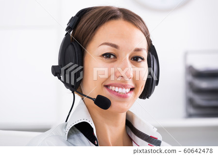 Woman talking with customer 60642478