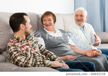 Parents and son enjoying evening Parents and son enjoying evening 60642539