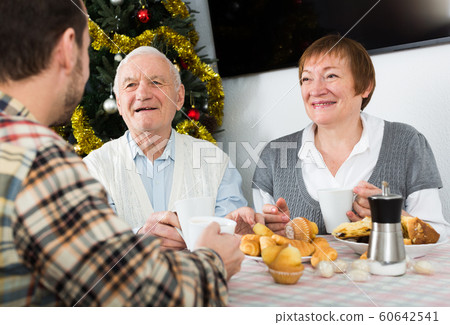 Family breakfast at Christmas table Family breakfast at Christmas table 60642541