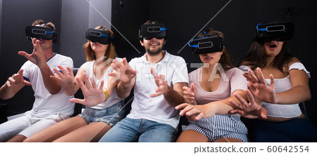 People wearing virtual reality goggles People wearing virtual reality goggles 60642554