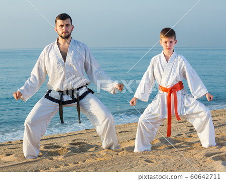 Man and boy practicing karate 60642711