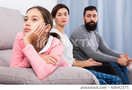 Parents lecturing daughter 60642875