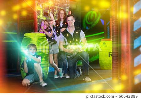 Famiy with laser pistols in beams Famiy with laser pistols in beams 60642889