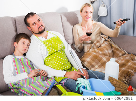 Sad man with boy with cleaning equipment 60642891