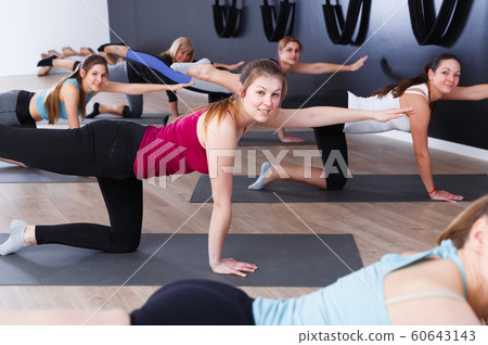 Women training in yoga studio Women training in yoga studio 60643143