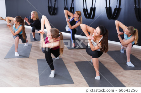 Girls practicing yoga positions indoors 60643256
