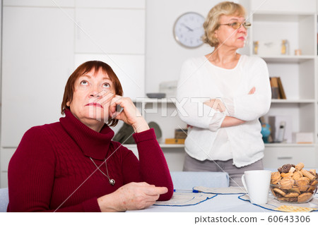 Pensioners females quarreling at kitchen Pensioners females quarreling at kitchen 60643306